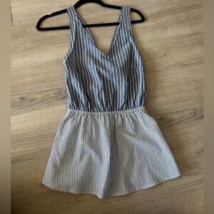 Peplum tank top with open back detail